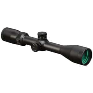 Black riflescope with elevation and windage turrets and a green-tinted objective lens