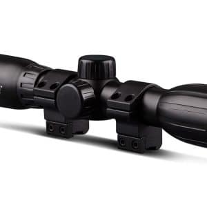 Black rifle scope with mounting rings and adjustable turrets, brand Konus on the side absorbent logo visible.