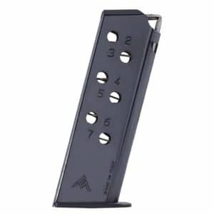 Black metal 7-round pistol magazine standing upright on its base with numbered holes 1–7 (made in Italy).