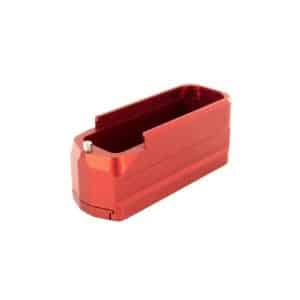 Red anodized aluminum rectangular battery holder with a shallow inner cavity and a small metal contact pin protruding from the front.