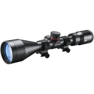 Black rifle scope with front objective lens and adjustable turrets mounted on two rings, matte finish for hunting rifles
