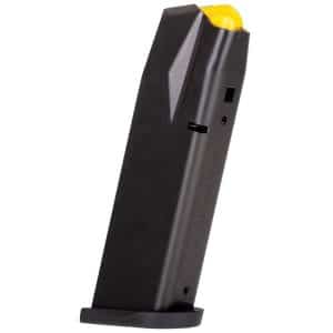 Black handgun magazine with a yellow follower, tilted to the side and resting on a base.