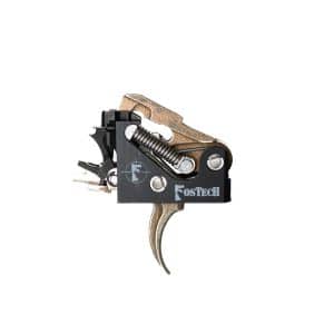 Close-up of a Fostech firearm trigger assembly with bronze levers and a black housing.