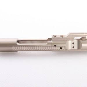 Metallic firearm component (bolt carrier) on a white background