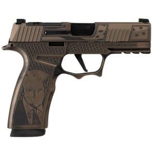 Bronze-colored semi-automatic pistol with an engraved grip showing a man's portrait and star-pattern details on the slide and frame.