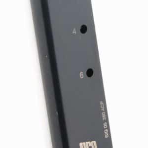 Black ProMag 380 ACP pistol magazine with a curved baseplate, numbered holes (2, 4, 6) along the side.