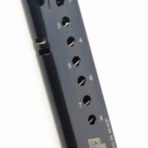 Black handgun magazine with eight round holes labeled 2 through 8, lying on its side