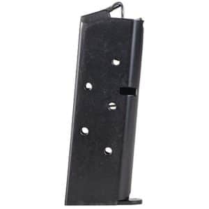 Black metal handgun magazine standing upright with load holes visible along the side and baseplate at the bottom
