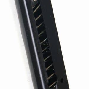 Black handgun magazine with visible internal springs, angled against a white background to the left side of the frame