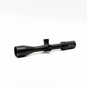 Black rifle scope with adjustable dials on a white background, lying horizontally