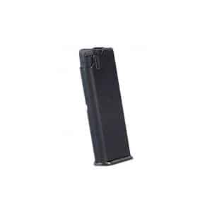 Black handgun magazine standing upright at a slight angle with a metal baseplate behind it.