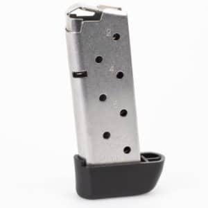 Silver semi-automatic pistol magazine with numbered round-count holes and a black base plate, standing upright.