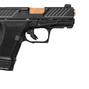 Side-view of a black semi-automatic handgun with a textured grip and copper-colored accents on the slide, shown against a white background.