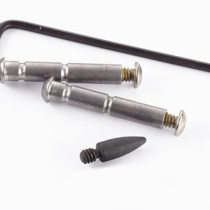 Two steel pins with threaded ends and rounded heads, a long black hex key, and a separate black rubber stopper plug nearby.