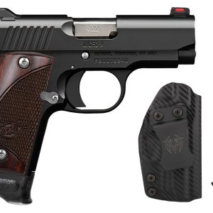 Black semi-automatic pistol with a brown wood grip, shown with a matching carbon-fiber holster and a separate metal magazine. Includes pistol, holster, and extra magazine.