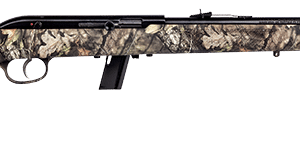 Camouflage-pattern hunting shotgun laid on a white background, showing a long barrel and stock.