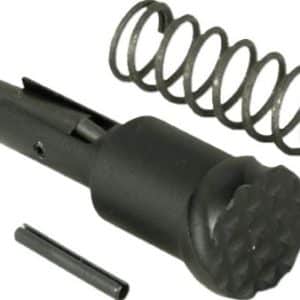 Disassembled mechanical plunger assembly showing a coiled spring, a black cylindrical plunger, and a small pin/rod. It appears to be a spring-loaded firing or actuating component.