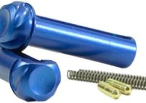 Two blue cylindrical pins with rounded heads, plus a long coil spring and a small brass connector on a white background