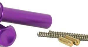 Purple silicone vibrator with interchangeable end pieces and a separate metal cleaning/attachment tool shown beside it.
