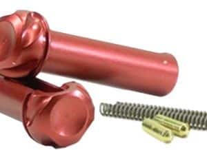 Red quick-release hitch pin with a yellow cotter pin and a small spring, used to secure equipment or implements