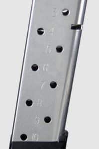 Metal pistol magazine with numbered round-count holes and a black baseplate.