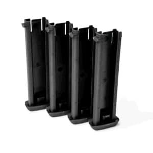 Row of tall black plastic magazine-like clips standing upright on a base, viewed from the side.