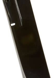 Black handgun magazine standing upright on a flat surface.