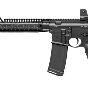 Black modern assault rifle shown in profile with foregrip, quad rails, and collapsible stock on a white background, ready for tactical use.