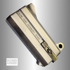 Two-tone Bond Arms derringer-style handgun tilted diagonally with 'Bond Arms Granbury, Texas' engraved on the barrel.