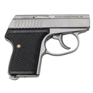 Side view of a silver semi-automatic handgun with a black textured grip
