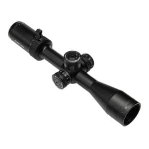 Black riflescope with four adjustment dials and a long eyepiece, angled on a white background