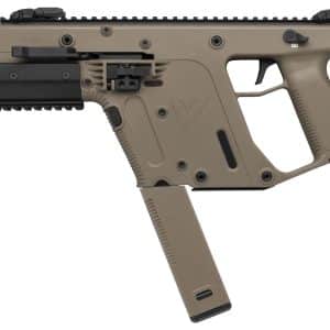 Close-up of a tan modular assault rifle with a black Picatinny rail, grip, and curved magazine inserted.