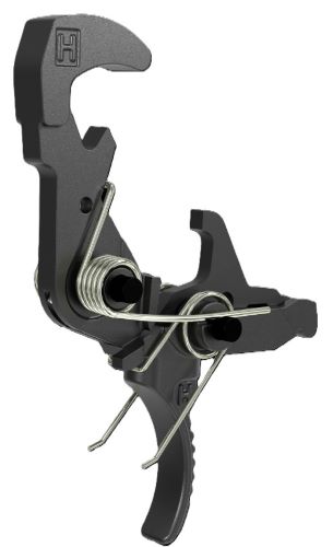 Close-up of a black metal clamp-like tool with curved jaws and two coil springs, a compact holding device.