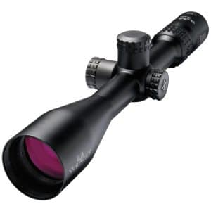 Close-up of a black riflescope with knurled adjustment knobs and a purple-tinted objective lens.