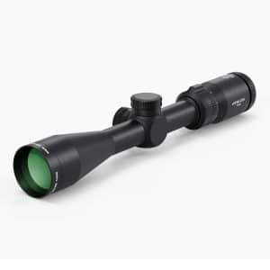 Black riflescope with green-tinted front lens and two adjustment knobs on a white background.