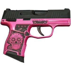 Pink handgun with a black slide and skull-flower pattern on the grip; decorative firearm prop.
