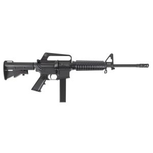 Black AR-style rifle with a vertical magazine and fixed stock, photographed from the left side on a white background.